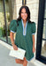 Classic with a modern twist, this hunter green dress is the definition of effortless fall style. Rich hunter green is beautifully accented with light blue and white trim along the front, sides, hem, and sleeves for a look that feels both timeless and eye-catching. The front button details and soft puff sleeves add just the right amount of charm, while the fully lined design and side pockets make it as comfortable as it is stylish. 