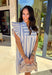Make an effortless statement in the Coastal Cruise Dress by Umgee. Designed with classic blue and white stripes, this easygoing dress features sweet ruffle sleeves that add just the right touch of charm. Lightweight and comfortable, it’s perfect for warm-weather days, whether you’re heading to brunch, strolling by the water, or dressing it up for a casual event. This is one of those throw-on-and-go pieces that always looks put together.