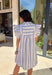 Make an effortless statement in the Coastal Cruise Dress by Umgee. Designed with classic blue and white stripes, this easygoing dress features sweet ruffle sleeves that add just the right touch of charm. Lightweight and comfortable, it’s perfect for warm-weather days, whether you’re heading to brunch, strolling by the water, or dressing it up for a casual event. This is one of those throw-on-and-go pieces that always looks put together.