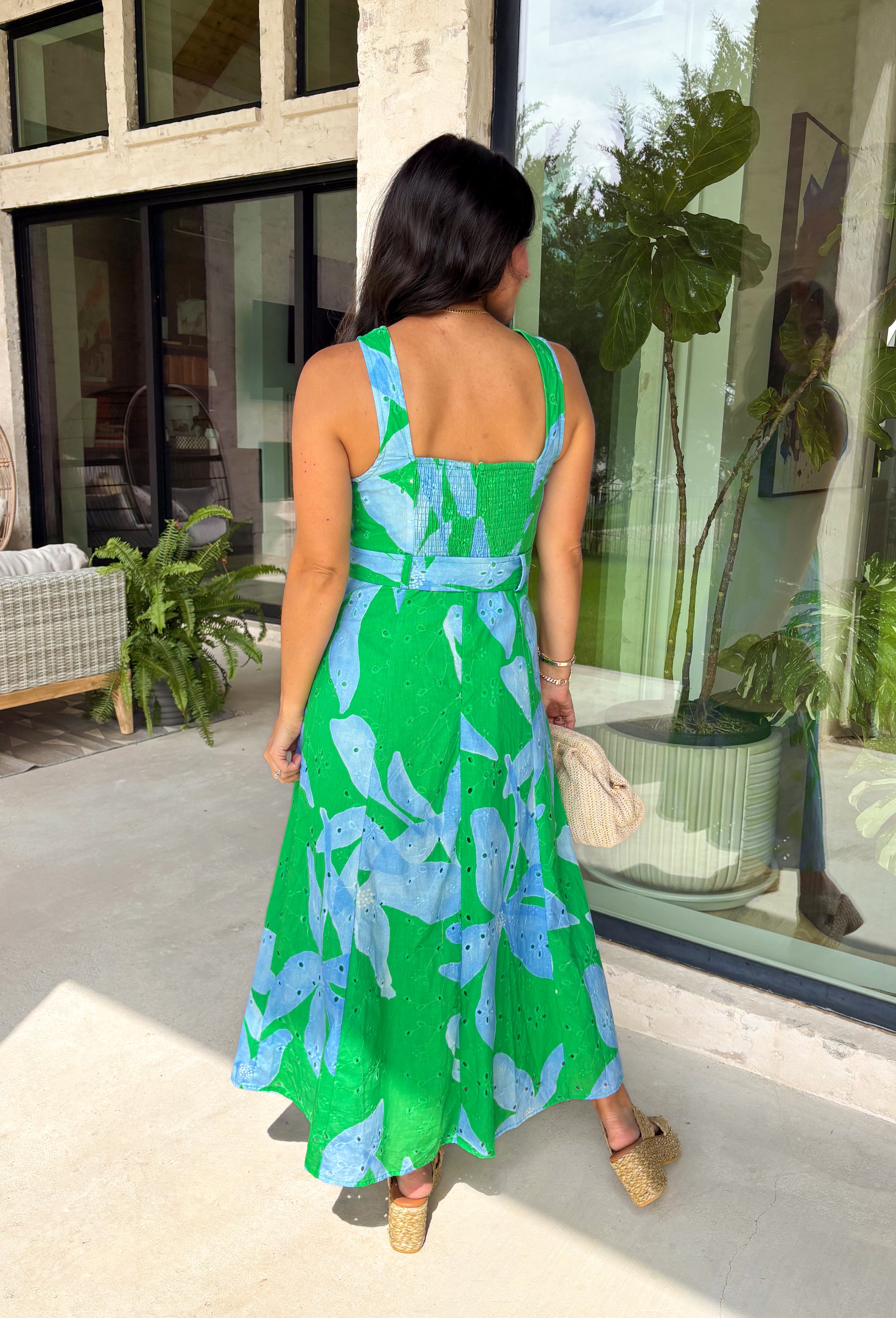 This green and blue botanical midi dress is the kind of piece that instantly makes you feel put together for summer! The vibrant print paired with gold button details gives it a polished, elevated look, while the belted waist creates a flattering silhouette. The smocked back adds comfort and flexibility, and the lightweight cotton keeps it breathable for warm days. Fully lined with pockets (always a win), it’s perfect for everything from brunch to special events. 