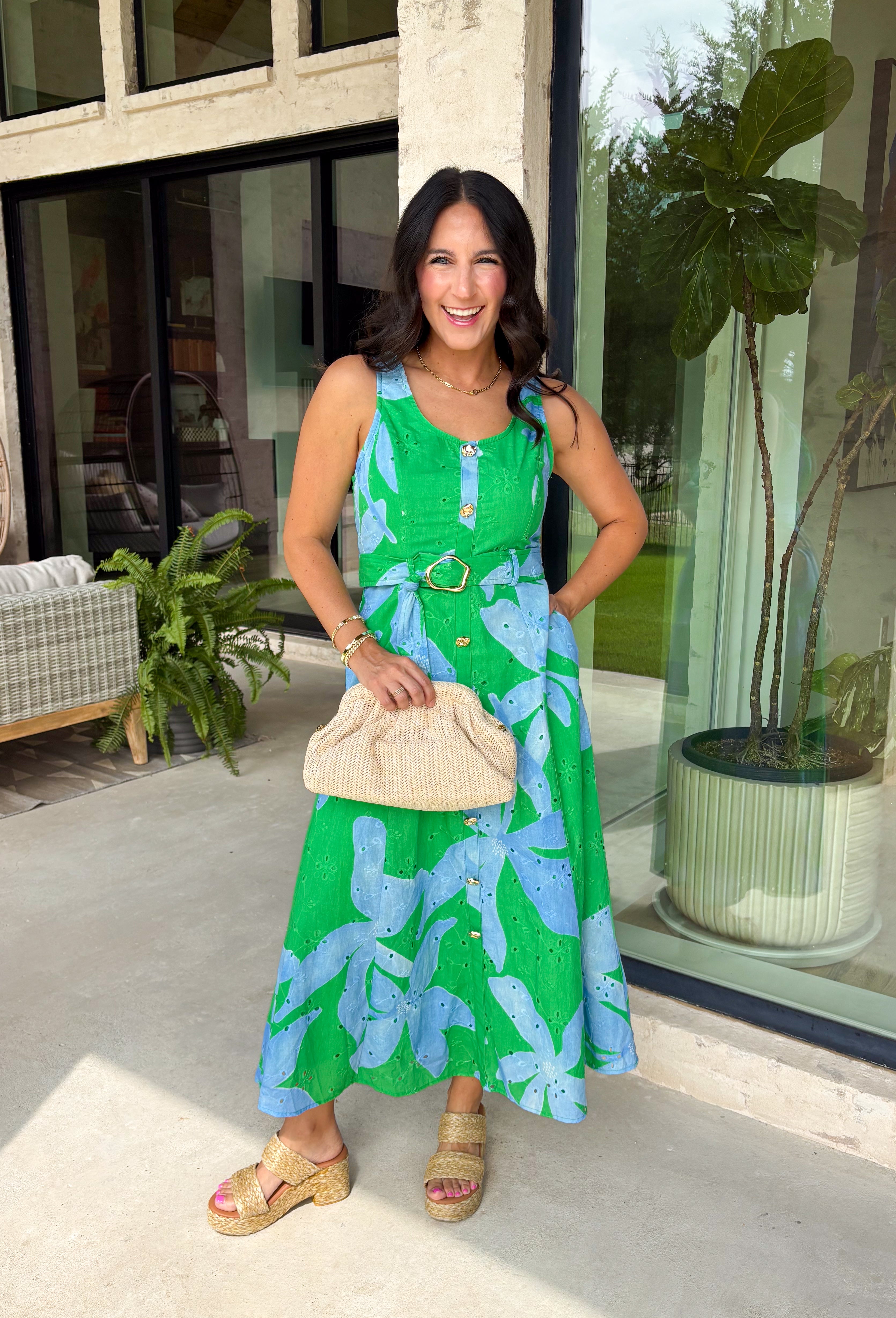 This green and blue botanical midi dress is the kind of piece that instantly makes you feel put together for summer! The vibrant print paired with gold button details gives it a polished, elevated look, while the belted waist creates a flattering silhouette. The smocked back adds comfort and flexibility, and the lightweight cotton keeps it breathable for warm days. Fully lined with pockets (always a win), it’s perfect for everything from brunch to special events. 