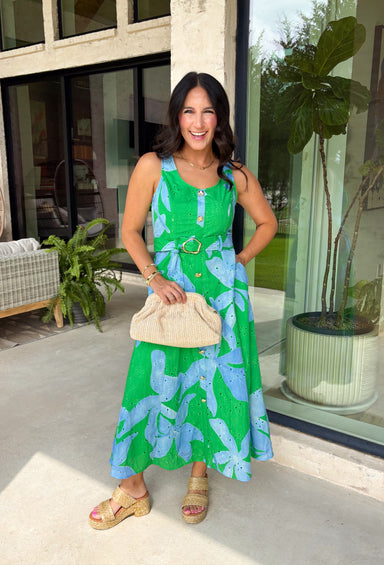 This green and blue botanical midi dress is the kind of piece that instantly makes you feel put together for summer! The vibrant print paired with gold button details gives it a polished, elevated look, while the belted waist creates a flattering silhouette. The smocked back adds comfort and flexibility, and the lightweight cotton keeps it breathable for warm days. Fully lined with pockets (always a win), it’s perfect for everything from brunch to special events. 