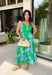 This green and blue botanical midi dress is the kind of piece that instantly makes you feel put together for summer! The vibrant print paired with gold button details gives it a polished, elevated look, while the belted waist creates a flattering silhouette. The smocked back adds comfort and flexibility, and the lightweight cotton keeps it breathable for warm days. Fully lined with pockets (always a win), it’s perfect for everything from brunch to special events. 