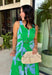 This green and blue botanical midi dress is the kind of piece that instantly makes you feel put together for summer! The vibrant print paired with gold button details gives it a polished, elevated look, while the belted waist creates a flattering silhouette. The smocked back adds comfort and flexibility, and the lightweight cotton keeps it breathable for warm days. Fully lined with pockets (always a win), it’s perfect for everything from brunch to special events. 