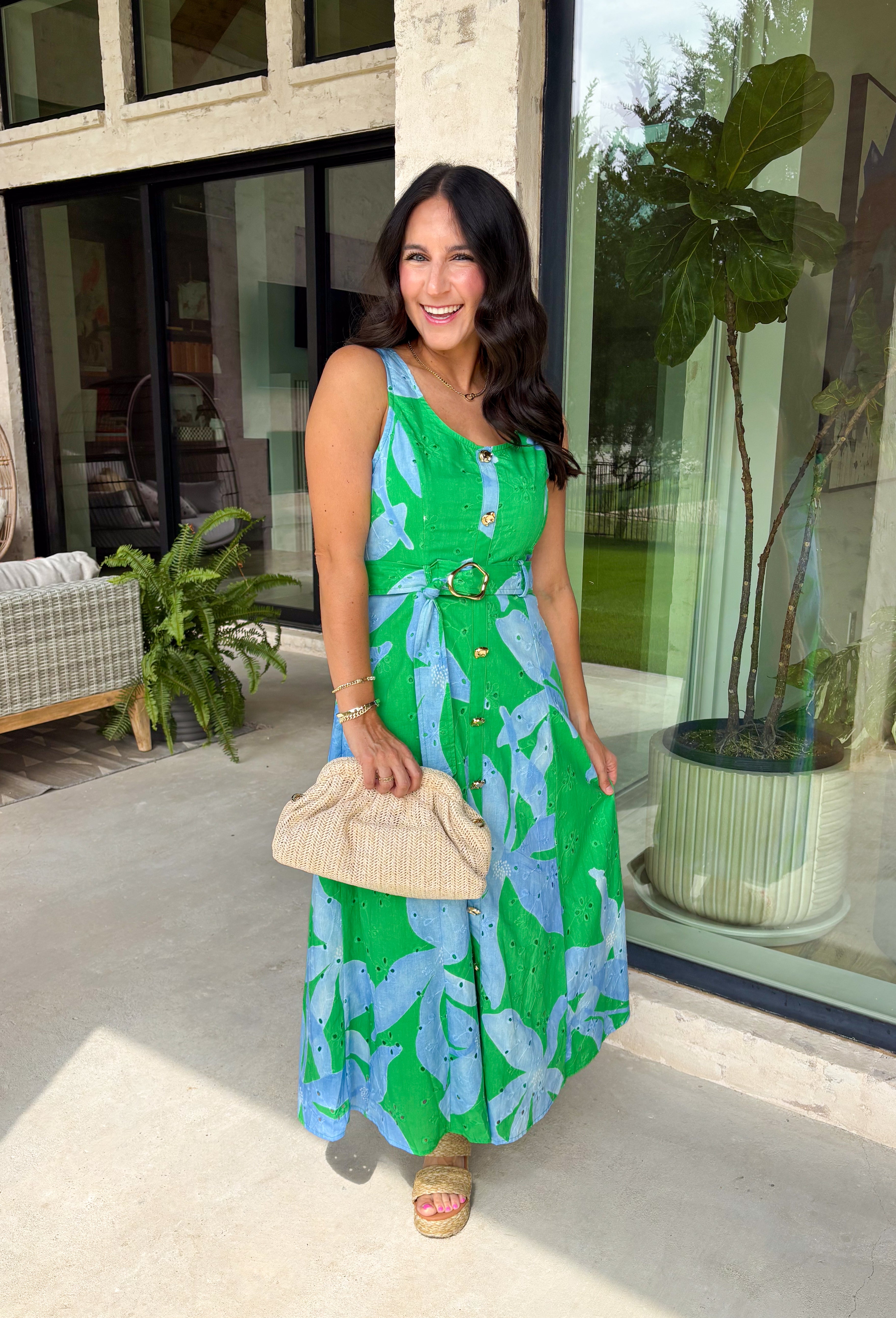 This green and blue botanical midi dress is the kind of piece that instantly makes you feel put together for summer! The vibrant print paired with gold button details gives it a polished, elevated look, while the belted waist creates a flattering silhouette. The smocked back adds comfort and flexibility, and the lightweight cotton keeps it breathable for warm days. Fully lined with pockets (always a win), it’s perfect for everything from brunch to special events. 