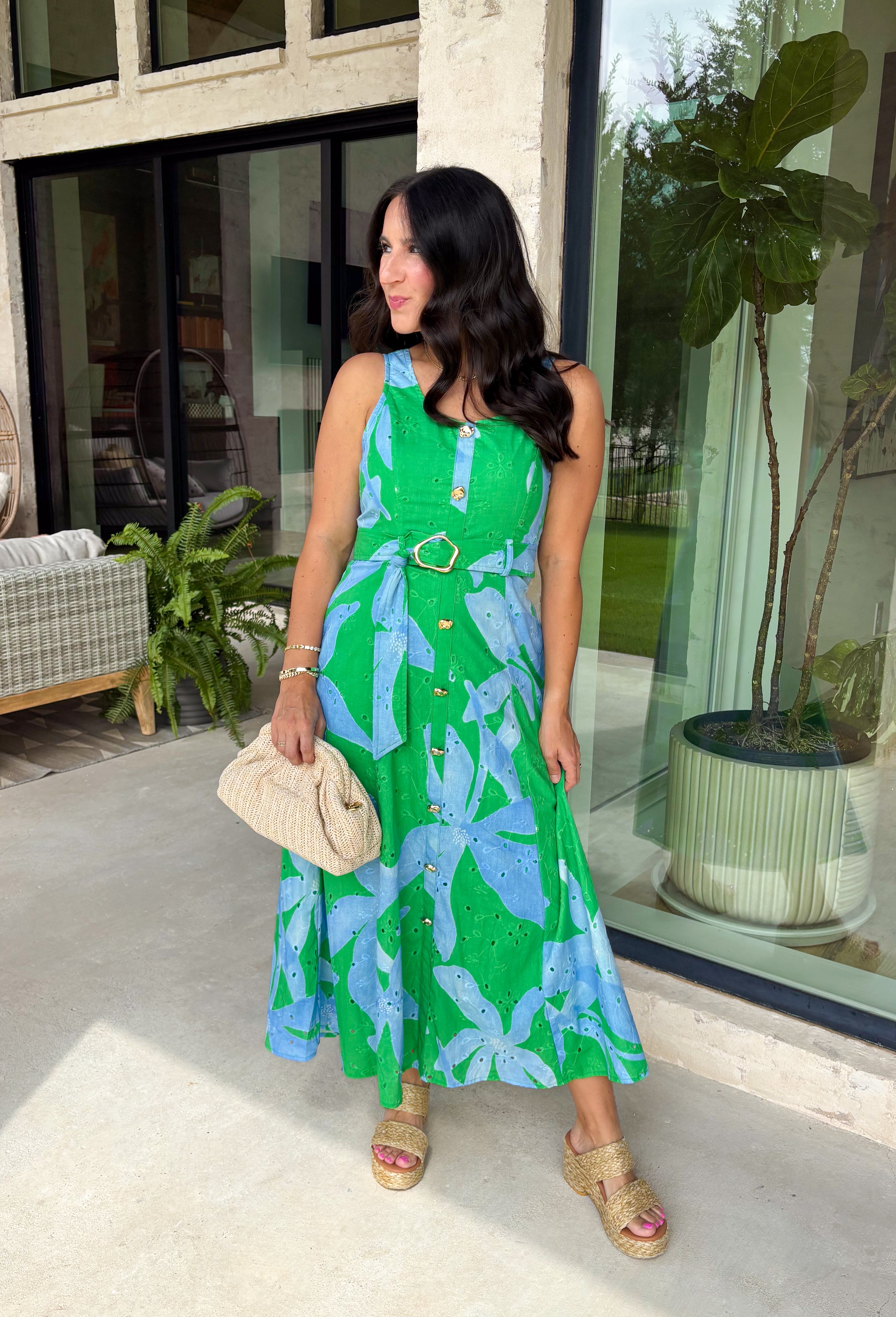 This green and blue botanical midi dress is the kind of piece that instantly makes you feel put together for summer! The vibrant print paired with gold button details gives it a polished, elevated look, while the belted waist creates a flattering silhouette. The smocked back adds comfort and flexibility, and the lightweight cotton keeps it breathable for warm days. Fully lined with pockets (always a win), it’s perfect for everything from brunch to special events. 