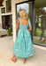 Fresh, playful, and made for sunny spring days, this green and white striped sleeveless midi dress is an effortless standout. The bold large stripe print gives it that classic, crisp look, while the smaller stripe pattern on the adjustable self-tie sleeves and along the front adds a fun contrast detail. Smocking along the back creates a comfortable, flattering fit, and side pockets make it even better (because we love a dress that’s cute and practical). Fully lined and breathable in cotton.
