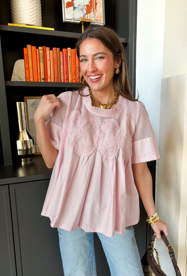 A little texture goes a long way! This short sleeve baby pink top by Fate combines soft cotton with airy mesh and delicate appliqué details for a unique, elevated twist on a classic top. Lightweight, breathable, and endlessly versatile, it’s the perfect piece to dress up or down, making it a year-round favorite for everything from coffee runs to casual dinners.