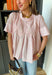 A little texture goes a long way! This short sleeve baby pink top by Fate combines soft cotton with airy mesh and delicate appliqué details for a unique, elevated twist on a classic top. Lightweight, breathable, and endlessly versatile, it’s the perfect piece to dress up or down, making it a year-round favorite for everything from coffee runs to casual dinners.