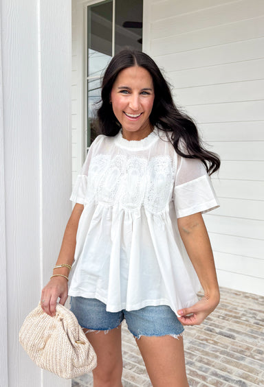 A little texture goes a long way! This short sleeve white top by Fate combines soft cotton with airy mesh and delicate appliqué details for a unique, elevated twist on a classic top. Lightweight, breathable, and endlessly versatile, it’s the perfect piece to dress up or down, making it a year-round favorite for everything from coffee runs to casual dinners.