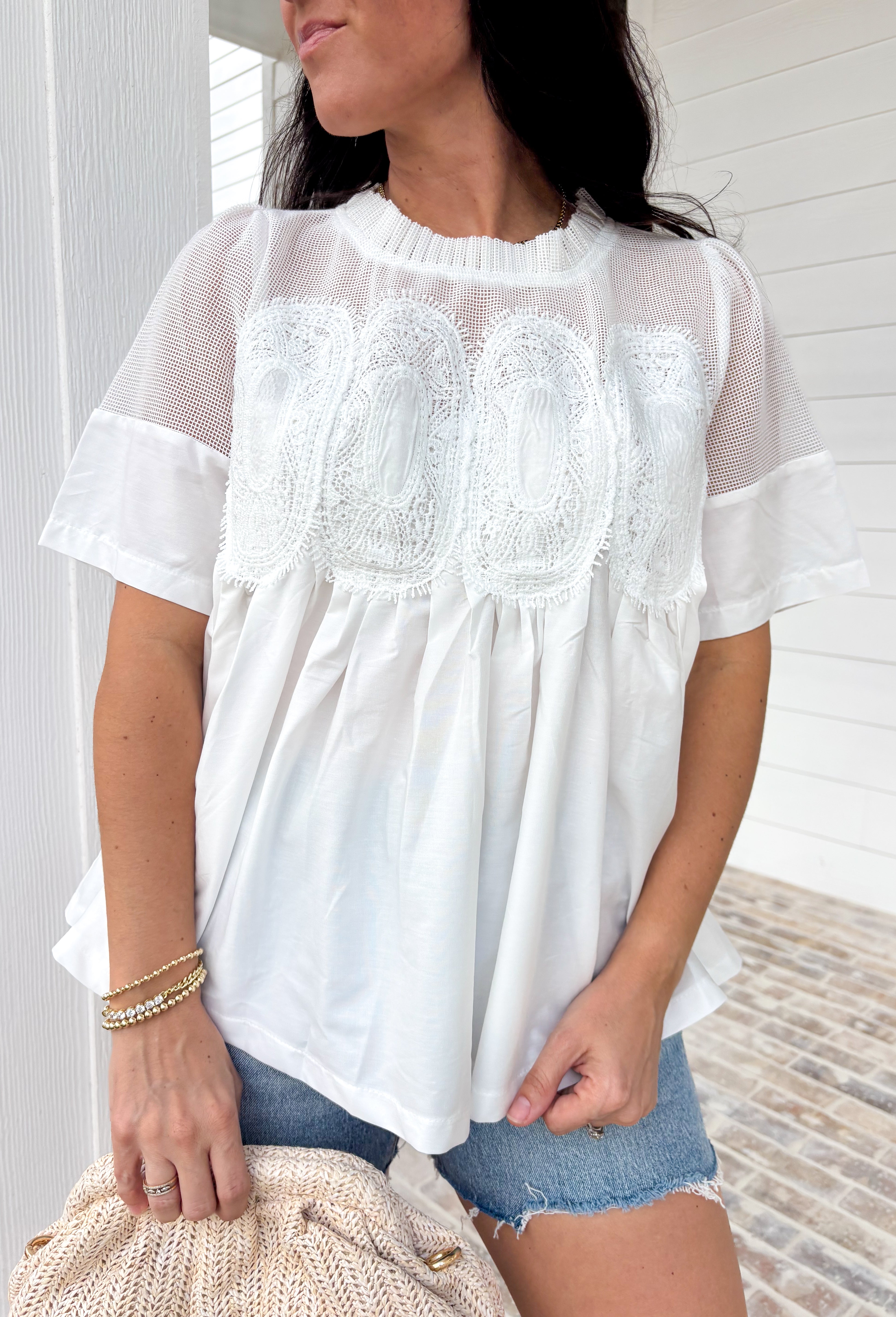 A little texture goes a long way! This short sleeve white top by Fate combines soft cotton with airy mesh and delicate appliqué details for a unique, elevated twist on a classic top. Lightweight, breathable, and endlessly versatile, it’s the perfect piece to dress up or down, making it a year-round favorite for everything from coffee runs to casual dinners.