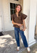 Simple details make all the difference in this effortlessly beautiful brown top! Crafted from a breathable cotton and linen blend, this timeless top is perfect for transitioning through the fall season. The flattering v-neckline is accented with delicate stitch detailing, while flutter sleeves add a soft, feminine touch. A button closure at the back completes the look with subtle charm. 