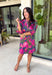 Make every occasion feel a little more special in this beautifully detailed dress from Entro. Featuring a stunning abstract print in rich shades of magenta, olive, navy, and pink, this feminine dress is full of eye-catching seasonal color. The ruffled mock neckline and button-front design create a timeless silhouette, while the matching self-tie belt flatters your waist for a customizable fit. Puff sleeves with elastic ruffle cuffs add a sweet finishing touch, and side pockets make it as practical.