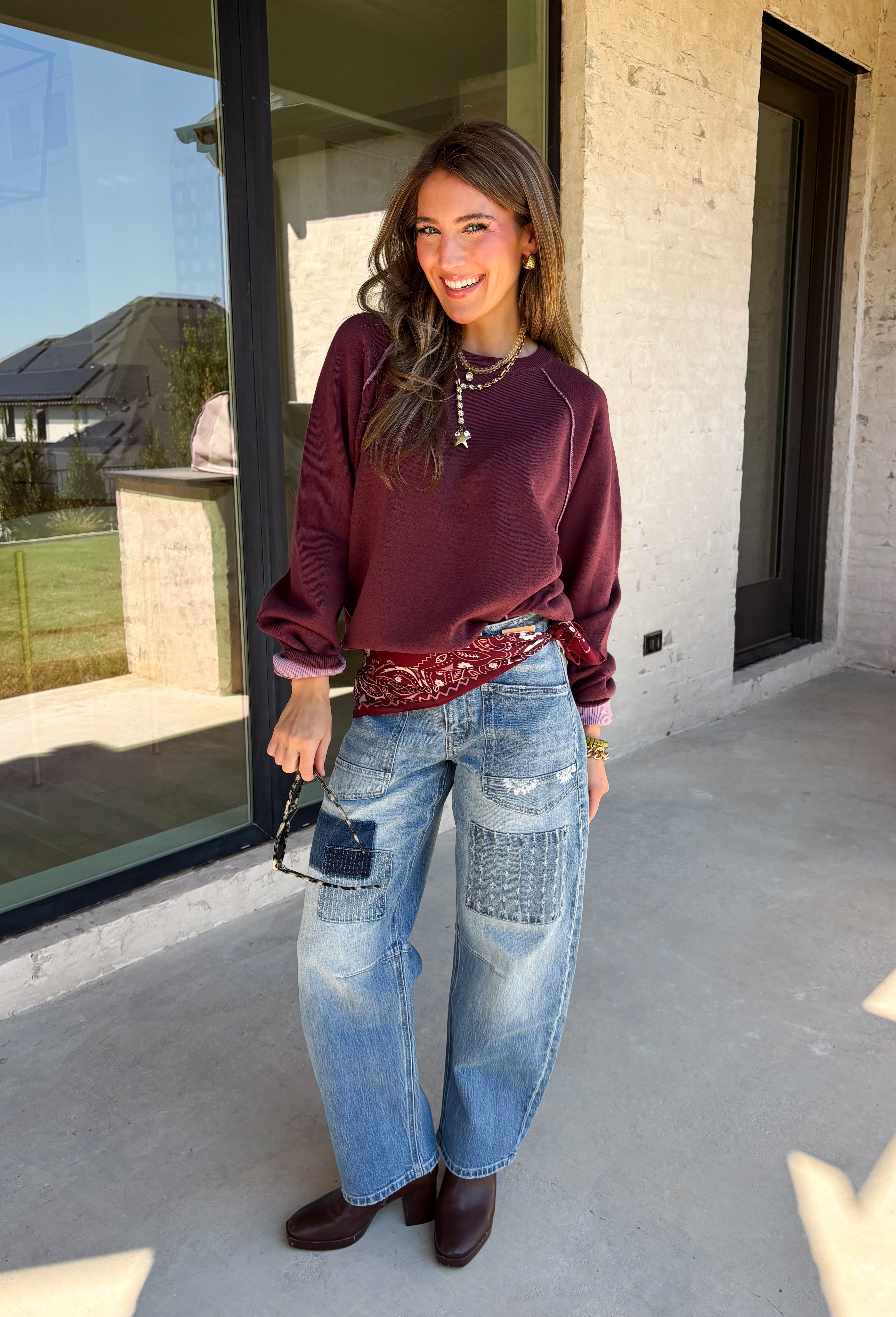 A cozy sweater with a little extra personality! This rich plum sweater features contrasting mauve exposed hems that add a soft, lived-in touch to the classic silhouette. The ribbed hem and sleeves create a comfortable fit while giving the sweater just the right amount of texture. Easy to style and perfect for chilly days, this cozy knit will quickly become a favorite for coffee runs, casual weekends, and fall outings.