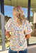 Fresh, feminine, and perfect for spring days, this cream gauze top by Umgee is full of cheerful charm. Featuring a colorful floral print in pink, green, and blue, this lightweight cotton top feels breezy and effortless. The blue scallop lace trim along the front adds a sweet detail, while the ruffled neckline and elastic cuff sleeves give it a soft, romantic finish that’s easy to wear all season long.