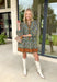 Chic and full of seasonal charm, this hunter green mini dress by Entro brings a fresh take on winter dressing. Featuring a geometric print in tan, white, brown, and lavender, it adds a modern twist to your cold-weather wardrobe. The contrast binding and ruffle hem offer feminine flair, while the lined design and side pocket make it as comfortable as it is stylish.