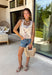 This ecru sleeveless top by Entro is giving sweet spring style with a little western twist. Featuring bold red novelty embroidery, it’s the perfect statement piece for sunny days, rodeo nights, and everything in between. The cropped length keeps it fun and flirty, while the square neckline adds a clean, flattering shape that pairs perfectly with high-rise denim.