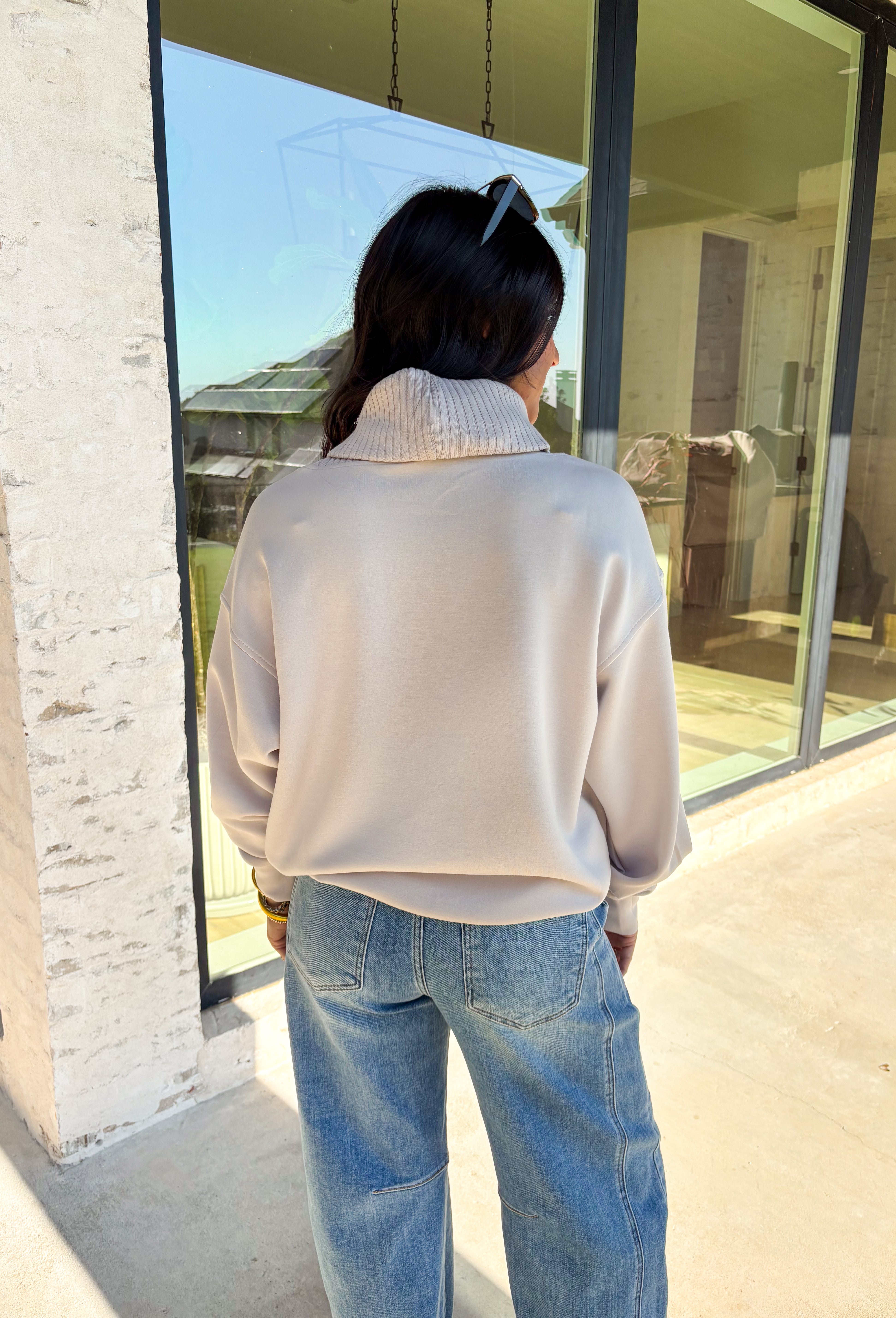 Classic and cozy, this neutral pullover is your new layering essential. The ribbed turtleneck design brings warmth and texture, while the soft modal-blend fabric keeps it comfortable with a hint of stretch. Long sleeves make it perfect for cooler weather, and the timeless silhouette pairs easily with jeans, skirts, or layered under jackets. Whether you’re heading out for errands or dressing it up for dinner, this pullover is a versatile go-to for the season.