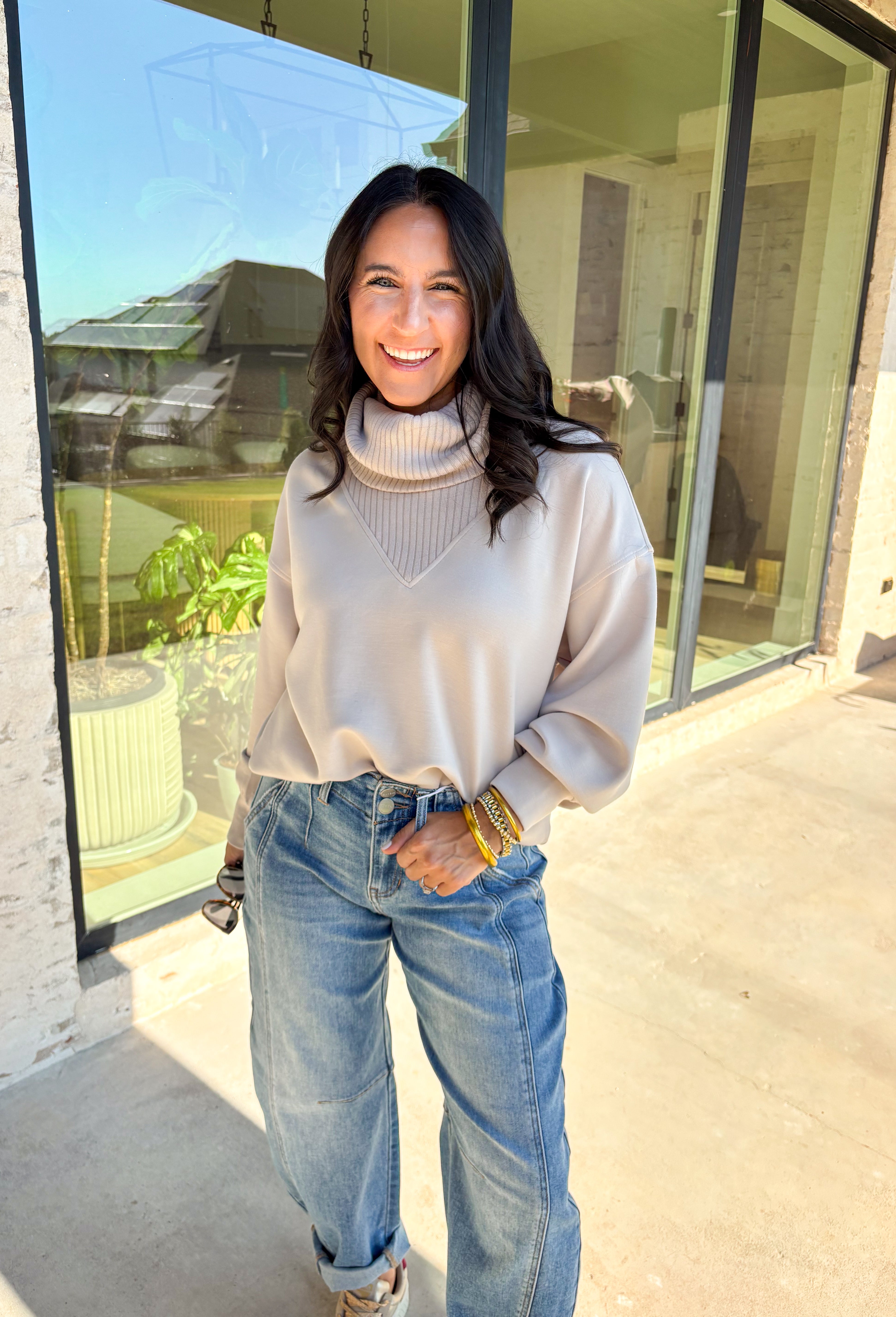 Classic and cozy, this neutral pullover is your new layering essential. The ribbed turtleneck design brings warmth and texture, while the soft modal-blend fabric keeps it comfortable with a hint of stretch. Long sleeves make it perfect for cooler weather, and the timeless silhouette pairs easily with jeans, skirts, or layered under jackets. Whether you’re heading out for errands or dressing it up for dinner, this pullover is a versatile go-to for the season.