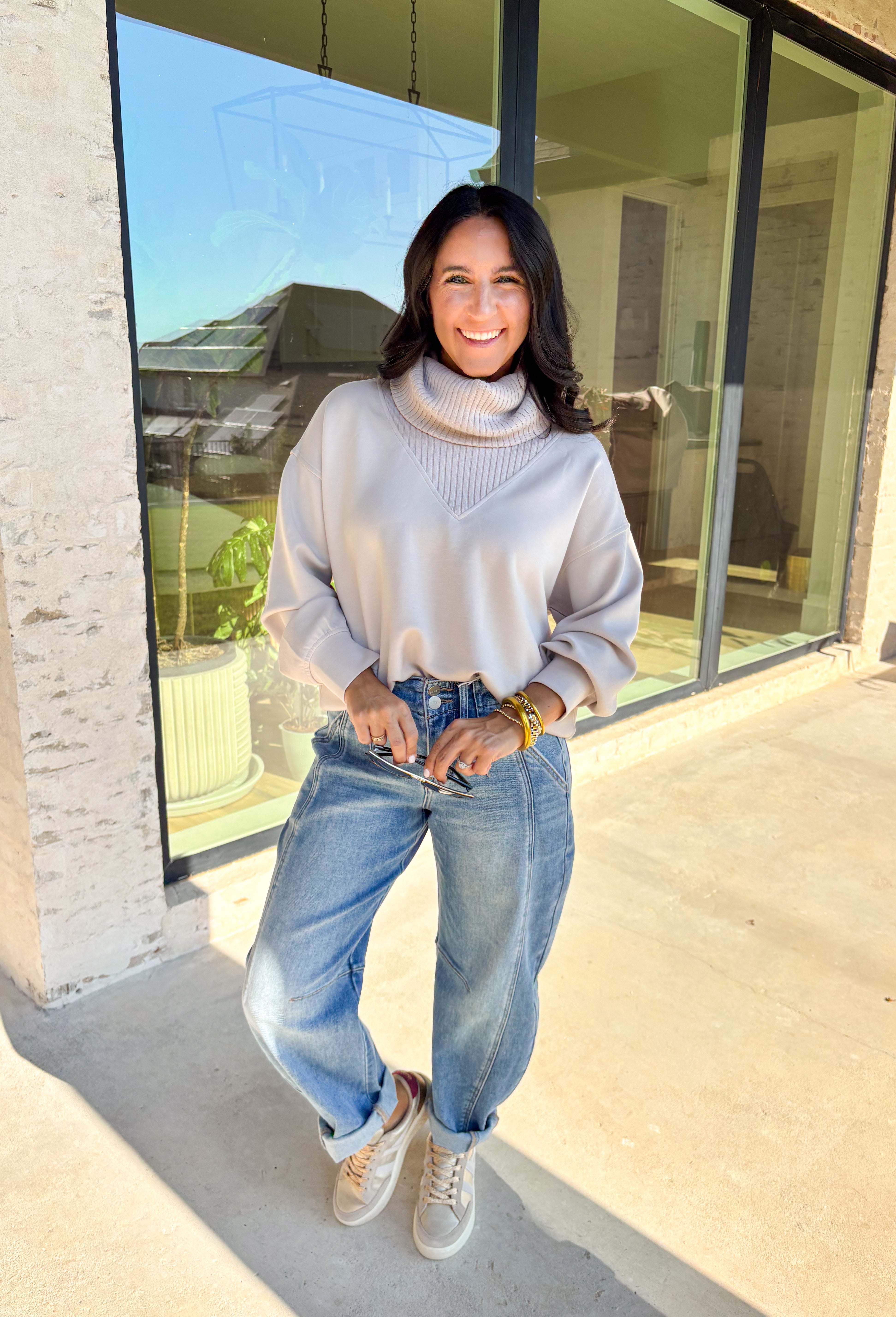 Classic and cozy, this neutral pullover is your new layering essential. The ribbed turtleneck design brings warmth and texture, while the soft modal-blend fabric keeps it comfortable with a hint of stretch. Long sleeves make it perfect for cooler weather, and the timeless silhouette pairs easily with jeans, skirts, or layered under jackets. Whether you’re heading out for errands or dressing it up for dinner, this pullover is a versatile go-to for the season.