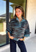 A dusty blue background gives this cozy knit sweater from Entro a fresh pop of color for the season. The darker abstract animal print creates a bold contrast against the dusty blue shade, adding plenty of personality without being difficult to style. A stand neckline and partial button-front closure bring a classic touch to the relaxed knit silhouette, while the ¾ sleeves make it a great option for transitional weather. 