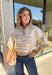 A neutral animal print gives this cozy knit top from Entro plenty of personality while keeping it easy to mix into your fall wardrobe. The abstract pattern brings together versatile neutral shades for a fresh take on a classic animal print. A stand neckline and partial button-front closure add structure to the relaxed knit silhouette, while the ¾ sleeves make it a great choice for those in-between weather days. 