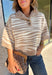 A neutral animal print gives this cozy knit top from Entro plenty of personality while keeping it easy to mix into your fall wardrobe. The abstract pattern brings together versatile neutral shades for a fresh take on a classic animal print. A stand neckline and partial button-front closure add structure to the relaxed knit silhouette, while the ¾ sleeves make it a great choice for those in-between weather days. 