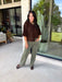 Cozy, classic, and endlessly versatile, this button-down cardigan from Double Zero is the perfect layering piece for the season. Designed in a rich dark brown hue, this soft knit cardigan is easy to style with everything from denim to dresses. The ribbed neckline adds a timeless touch, while the cozy knit construction keeps you comfortable throughout the day. Wear it buttoned as a sweater or open over your favorite basics for an effortlessly polished fall look.