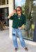 Cozy, classic, and endlessly versatile, this button-down cardigan from Double Zero is the perfect layering piece for the season. Designed in a rich dark green hue, this soft knit cardigan is easy to style with everything from denim to dresses. The ribbed neckline adds a timeless touch, while the cozy knit construction keeps you comfortable throughout the day. Wear it buttoned as a sweater or open over your favorite basics for an effortlessly polished fall look.
