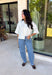 Cozy, classic, and endlessly versatile, this button-down cardigan from Double Zero is the perfect layering piece for the season. Designed in a neutral whip cream hue, this soft knit cardigan is easy to style with everything from denim to dresses. The ribbed neckline adds a timeless touch, while the cozy knit construction keeps you comfortable throughout the day. Wear it buttoned as a sweater or open over your favorite basics for an effortlessly polished fall look.