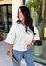 Cozy, classic, and endlessly versatile, this button-down cardigan from Double Zero is the perfect layering piece for the season. Designed in a neutral whip cream hue, this soft knit cardigan is easy to style with everything from denim to dresses. The ribbed neckline adds a timeless touch, while the cozy knit construction keeps you comfortable throughout the day. Wear it buttoned as a sweater or open over your favorite basics for an effortlessly polished fall look.