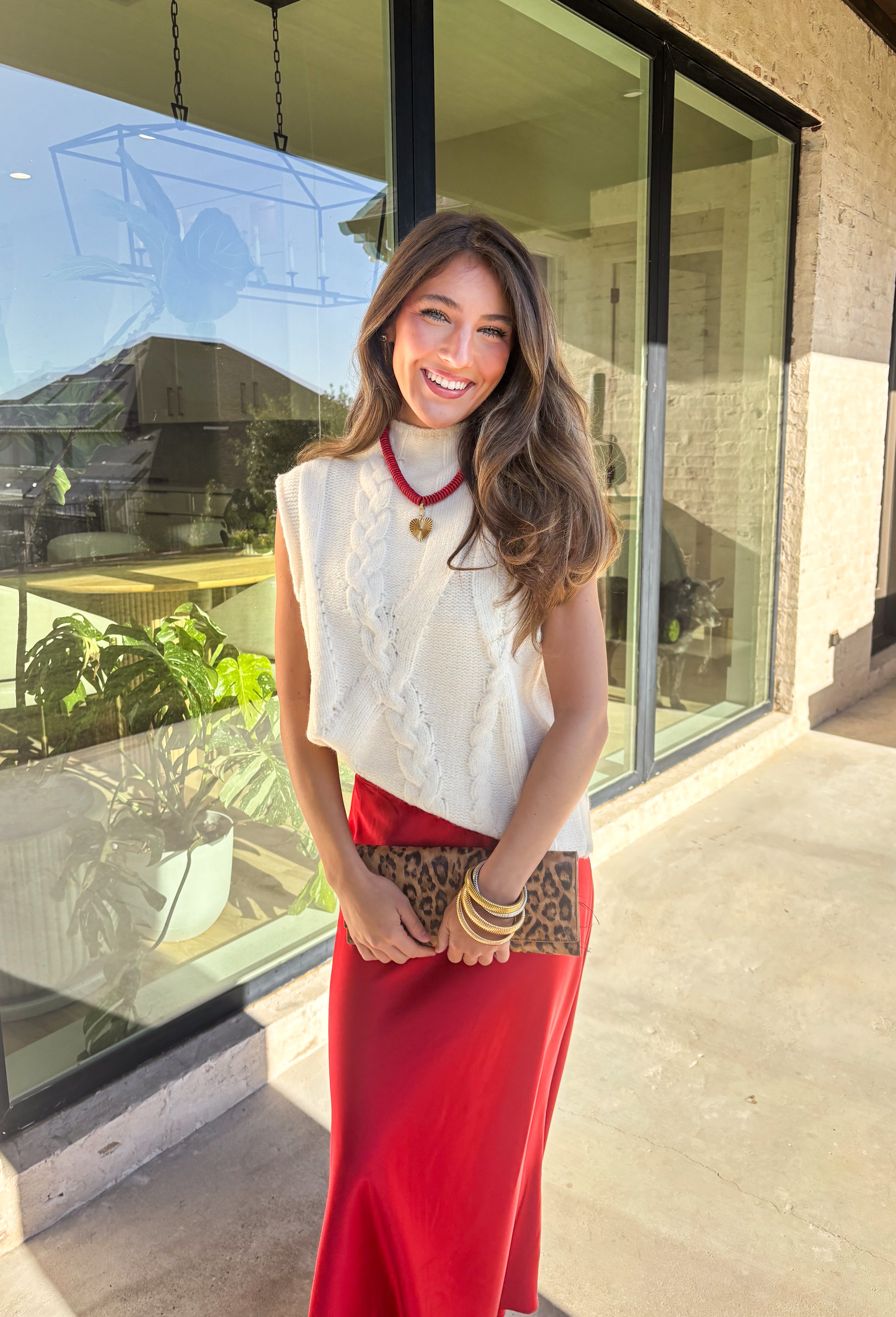 This cream cable knit sweater is the layering piece your fall wardrobe has been waiting for. Designed sleeveless with a mock neckline, it’s both versatile and cozy, making it easy to wear on its own or styled over your favorite blouses. The chunky knit texture adds timeless appeal, while the neutral cream tone keeps it a go-to for any outfit. Lightweight yet warm, it’s a perfect match for transitional days that call for comfort with style.