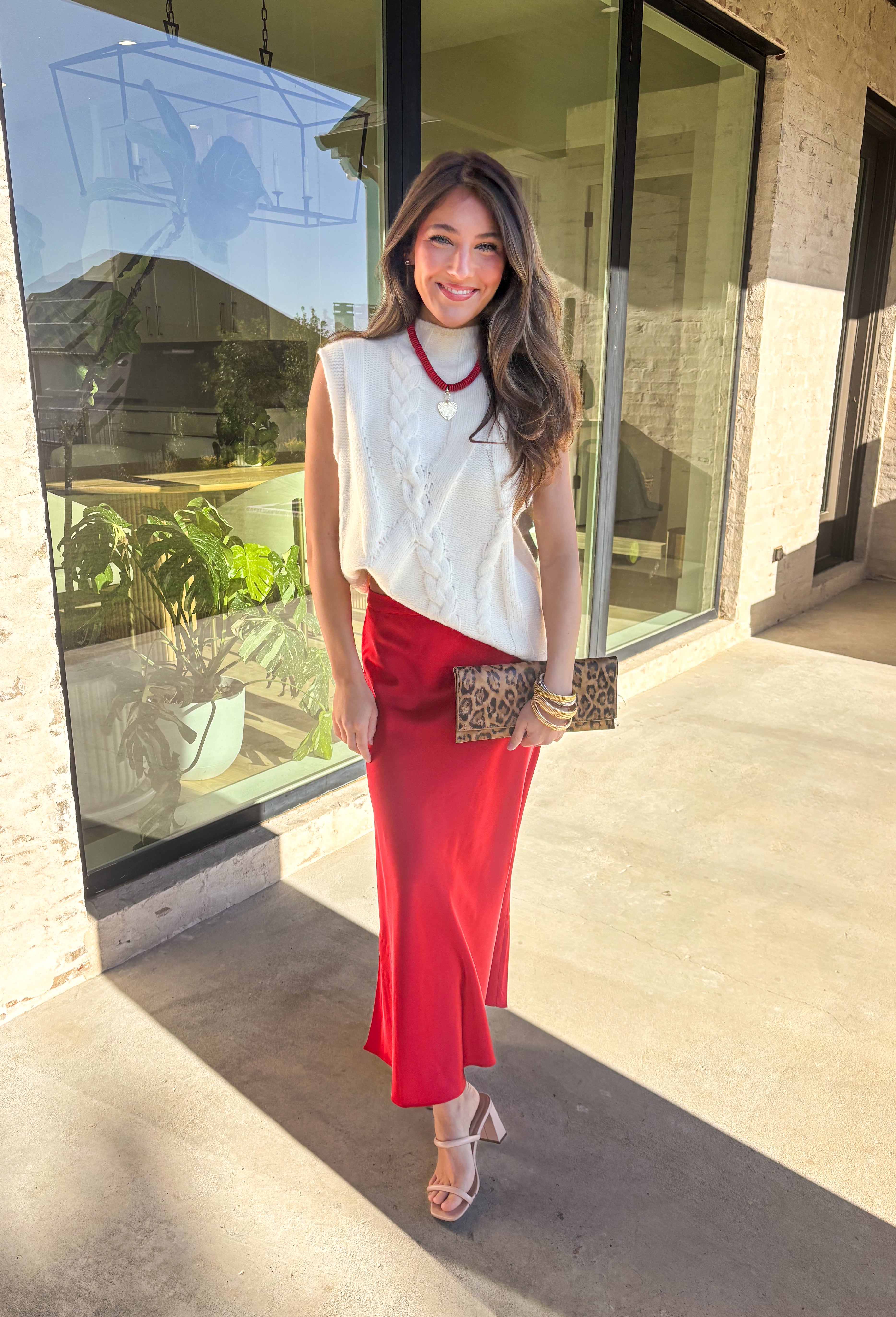 This cream cable knit sweater is the layering piece your fall wardrobe has been waiting for. Designed sleeveless with a mock neckline, it’s both versatile and cozy, making it easy to wear on its own or styled over your favorite blouses. The chunky knit texture adds timeless appeal, while the neutral cream tone keeps it a go-to for any outfit. Lightweight yet warm, it’s a perfect match for transitional days that call for comfort with style.