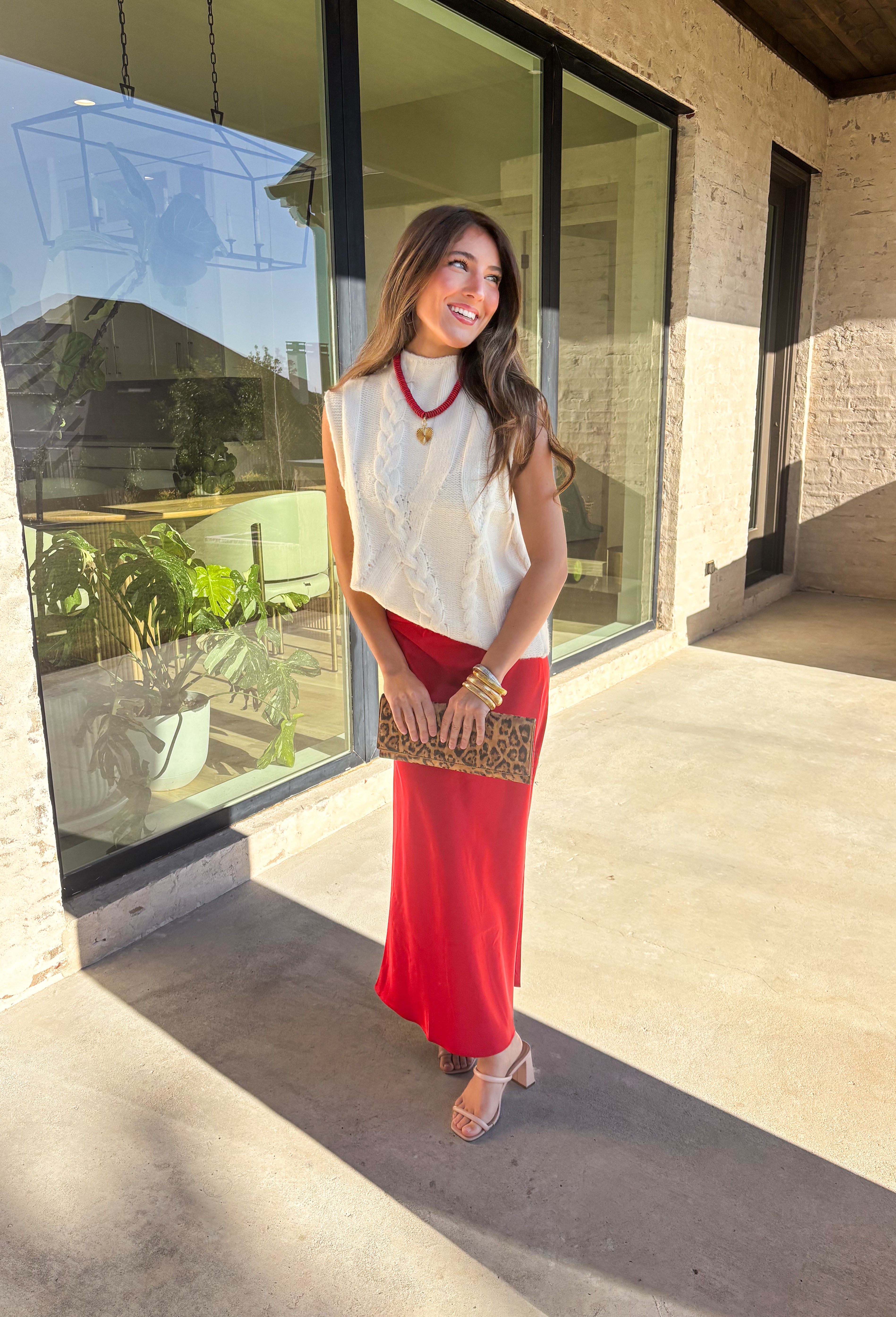 This cream cable knit sweater is the layering piece your fall wardrobe has been waiting for. Designed sleeveless with a mock neckline, it’s both versatile and cozy, making it easy to wear on its own or styled over your favorite blouses. The chunky knit texture adds timeless appeal, while the neutral cream tone keeps it a go-to for any outfit. Lightweight yet warm, it’s a perfect match for transitional days that call for comfort with style.