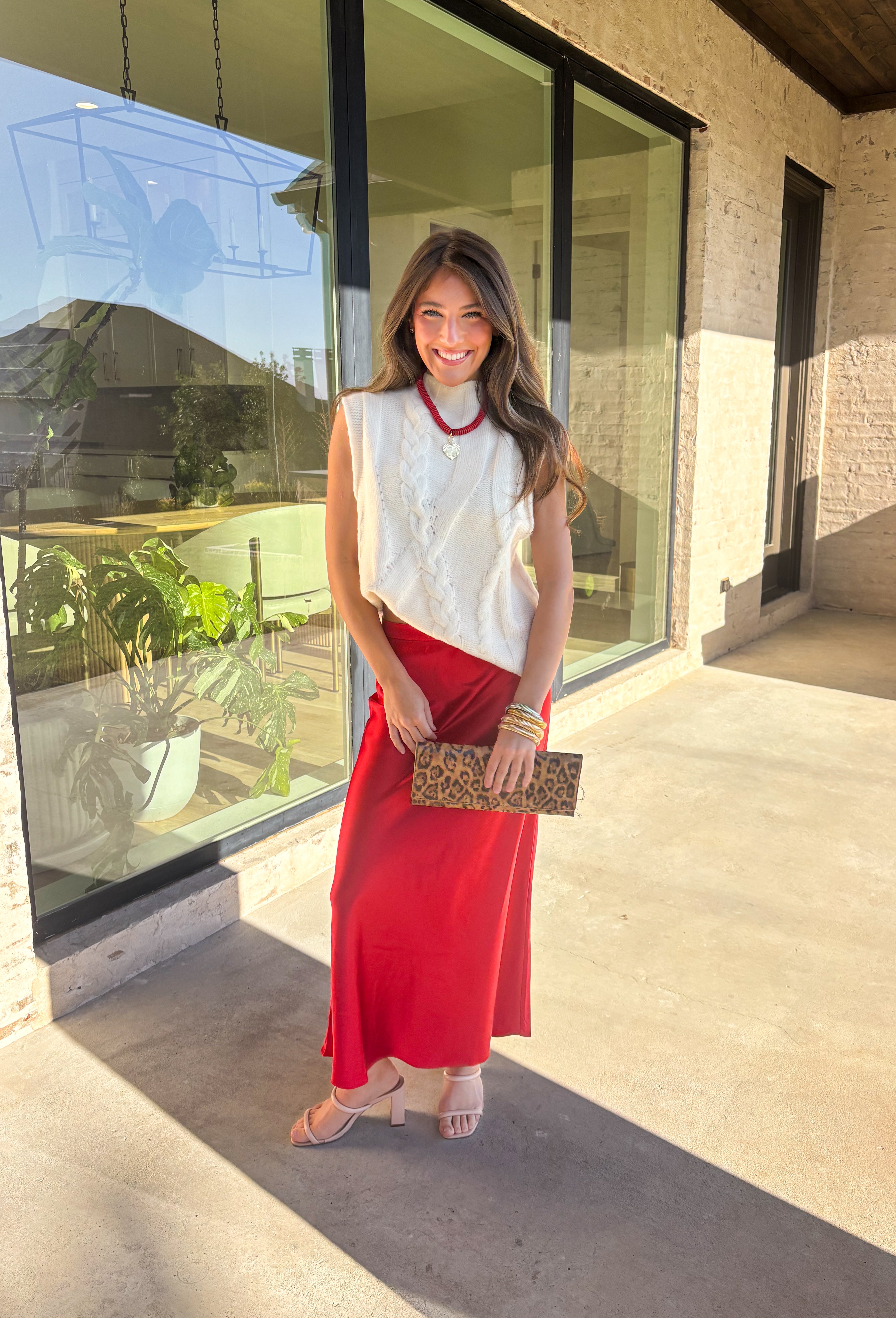 This cream cable knit sweater is the layering piece your fall wardrobe has been waiting for. Designed sleeveless with a mock neckline, it’s both versatile and cozy, making it easy to wear on its own or styled over your favorite blouses. The chunky knit texture adds timeless appeal, while the neutral cream tone keeps it a go-to for any outfit. Lightweight yet warm, it’s a perfect match for transitional days that call for comfort with style.