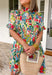 Bright, cheerful, and full of spring charm, this off-white short sleeve dress by Entro is an instant mood booster. Featuring a colorful floral print with pops of green, blue, red, and pink, it feels lively yet easy to wear. The ruffle neckline, ruffle sleeves, and ruffle trim down the front add a soft, feminine touch, while the pleating detail and front button accents give it a polished finish. 