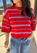 Bold, breezy, and perfect for spring layering, this striped knit top by Entro brings an easy pop of color to your everyday look. Featuring red and light blue stripes with a relaxed drop shoulder fit, it feels laid-back yet polished. The ribbed neckline, cuffs, and hem add subtle structure, while the cropped length keeps it fun and on-trend. Lightweight and comfortable, it’s an easy piece to style all season long.
