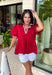 This red babydoll top is the perfect blend of playful and polished for the fall season! The rich red color makes a statement, while the crisp white contrast trim along the collar, front, and sleeves adds a classic touch that never goes out of style. Puff sleeves and the relaxed babydoll silhouette create an easy, flattering fit you'll love for busy days and weekend plans alike. Made from breathable cotton, it's comfortable enough for all-day wear and easy to layer under a denim jacket.