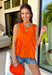 This orange sleeveless top is the versatile staple your wardrobe needs all year long! The vibrant color makes it a standout choice for game day season, while the clean, classic silhouette ensures you'll wear it far beyond football weekends. Designed with a high round neckline and a simple keyhole button closure in the back, it has an elevated look that's easy to dress up or down.