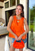 This orange sleeveless top is the versatile staple your wardrobe needs all year long! The vibrant color makes it a standout choice for game day season, while the clean, classic silhouette ensures you'll wear it far beyond football weekends. Designed with a high round neckline and a simple keyhole button closure in the back, it has an elevated look that's easy to dress up or down.