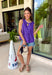 This purple sleeveless top is the versatile staple your wardrobe needs all year long! The vibrant color makes it a standout choice for game day season, while the clean, classic silhouette ensures you'll wear it far beyond football weekends. Designed with a high round neckline and a simple keyhole button closure in the back, it has an elevated look that's easy to dress up or down. 