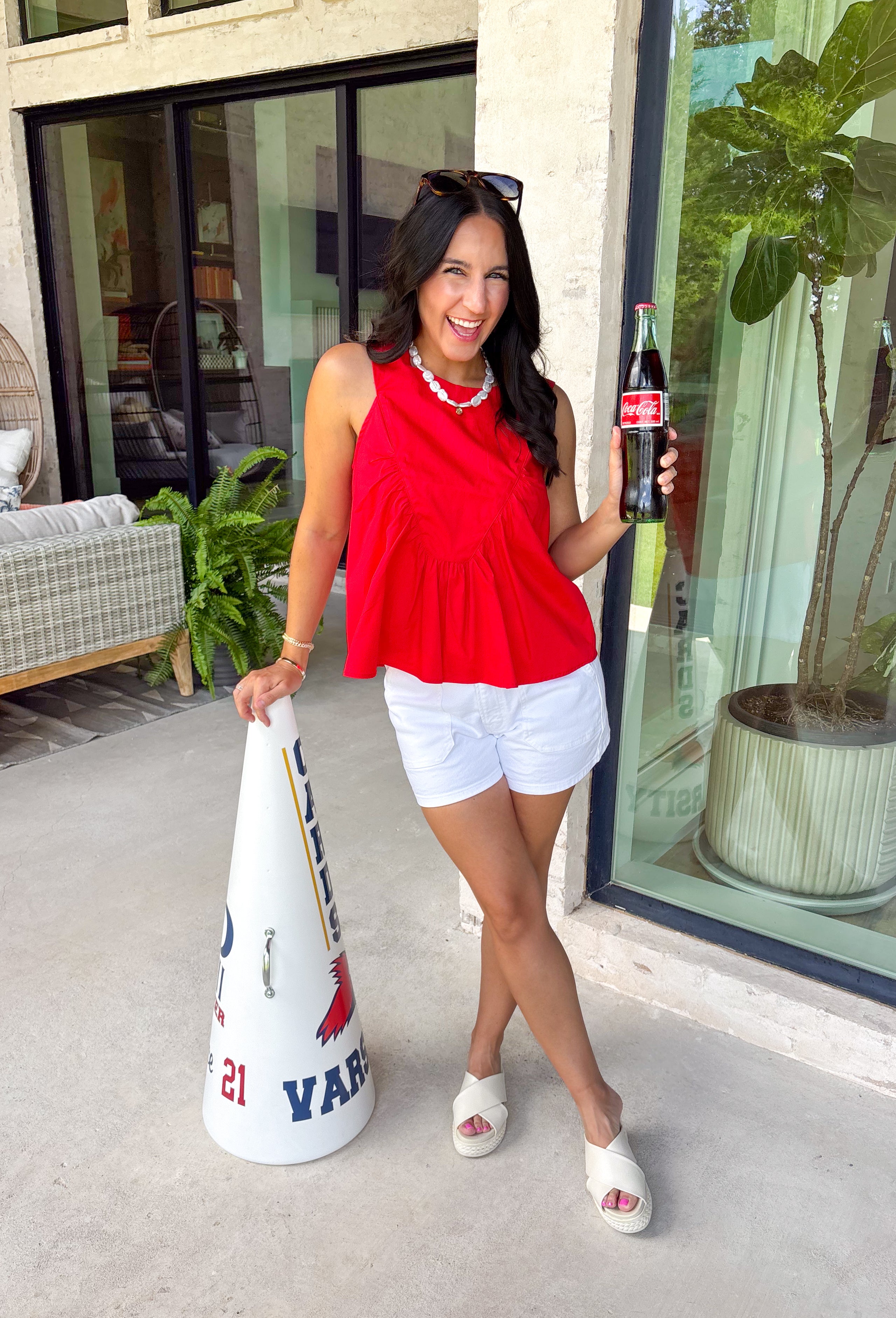 This red sleeveless top is the versatile staple your wardrobe needs all year long! The vibrant color makes it a standout choice for game day season, while the clean, classic silhouette ensures you'll wear it far beyond football weekends. Designed with a high round neckline and a simple keyhole button closure in the back, it has an elevated look that's easy to dress up or down.
