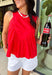 This red sleeveless top is the versatile staple your wardrobe needs all year long! The vibrant color makes it a standout choice for game day season, while the clean, classic silhouette ensures you'll wear it far beyond football weekends. Designed with a high round neckline and a simple keyhole button closure in the back, it has an elevated look that's easy to dress up or down.