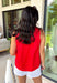 This red sleeveless top is the versatile staple your wardrobe needs all year long! The vibrant color makes it a standout choice for game day season, while the clean, classic silhouette ensures you'll wear it far beyond football weekends. Designed with a high round neckline and a simple keyhole button closure in the back, it has an elevated look that's easy to dress up or down.