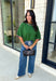 Add a playful pop of color to your fall wardrobe with this cozy short sleeve sweater! Featuring a rich pine green knit with soft pink contrast trim, this sweater is the perfect mix of timeless and fun. The ribbed detailing along the neckline, sleeves, and hem adds a classic finishing touch, while the lightweight knit keeps it comfortable for layering throughout the season. 