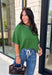 Add a playful pop of color to your fall wardrobe with this cozy short sleeve sweater! Featuring a rich pine green knit with soft pink contrast trim, this sweater is the perfect mix of timeless and fun. The ribbed detailing along the neckline, sleeves, and hem adds a classic finishing touch, while the lightweight knit keeps it comfortable for layering throughout the season. 