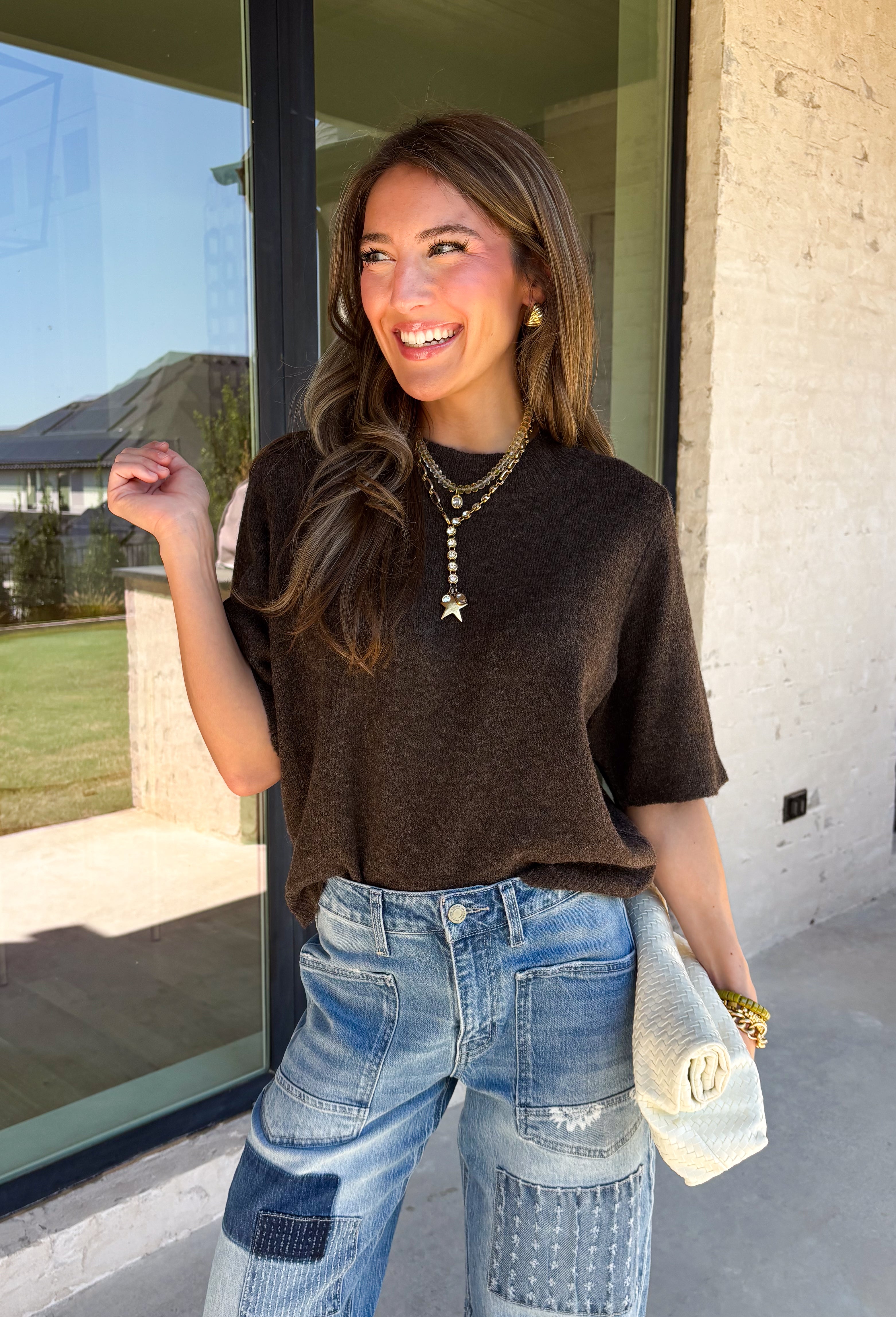 Every fall wardrobe needs a sweater like this! Soft, cozy, and endlessly versatile, this cocoa mock neck short sleeve sweater is the perfect layering piece for the season. The lightweight knit makes it comfortable enough for warmer autumn afternoons while still providing the cozy feel you'll love as temperatures begin to cool. Finished with a classic mock neckline and ribbed detailing, this timeless sweater pairs effortlessly with everything from your favorite denim to tailored trousers.