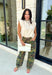 Elevate your everyday wardrobe with this effortlessly polished knit top that offers two stylish looks in one! Crafted in a versatile ecru hue, this soft sweater features a ribbed mock neckline and an adorable removable black polka dot scarf for a touch of timeless charm. Wear the scarf for a chic, vintage-inspired look, or remove it for a clean and classic knit you'll reach for again and again. 