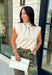 Elevate your everyday wardrobe with this effortlessly polished knit top that offers two stylish looks in one! Crafted in a versatile ecru hue, this soft sweater features a ribbed mock neckline and an adorable removable black polka dot scarf for a touch of timeless charm. Wear the scarf for a chic, vintage-inspired look, or remove it for a clean and classic knit you'll reach for again and again. 