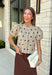 A classic print meets an effortlessly feminine silhouette in this charming knit cardigan! Featuring a soft tan knit with a playful brown polka dot print, this button-down cardigan is finished with sweet puff sleeves for an elevated touch. Whether worn buttoned as a top or layered over your favorite basics, this versatile piece is perfect for everything from office days to coffee dates and weekend outings.